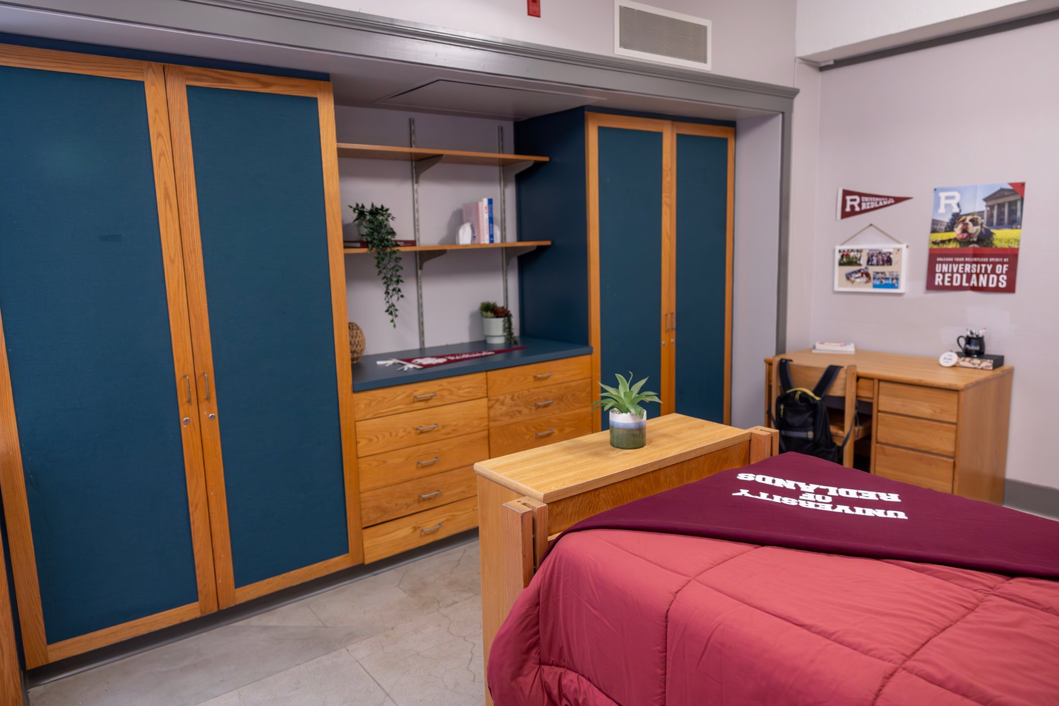 a room with a bed and a desk