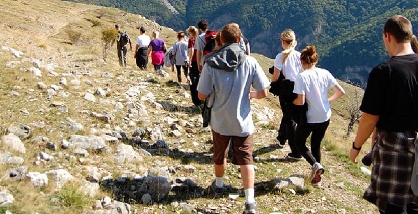 a group of people hiking on a mountain