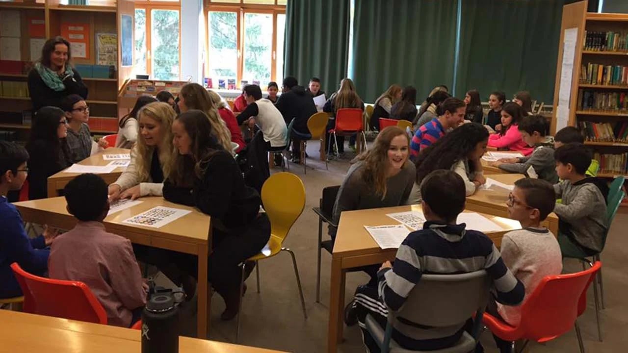 a group of people sitting at tables in a room