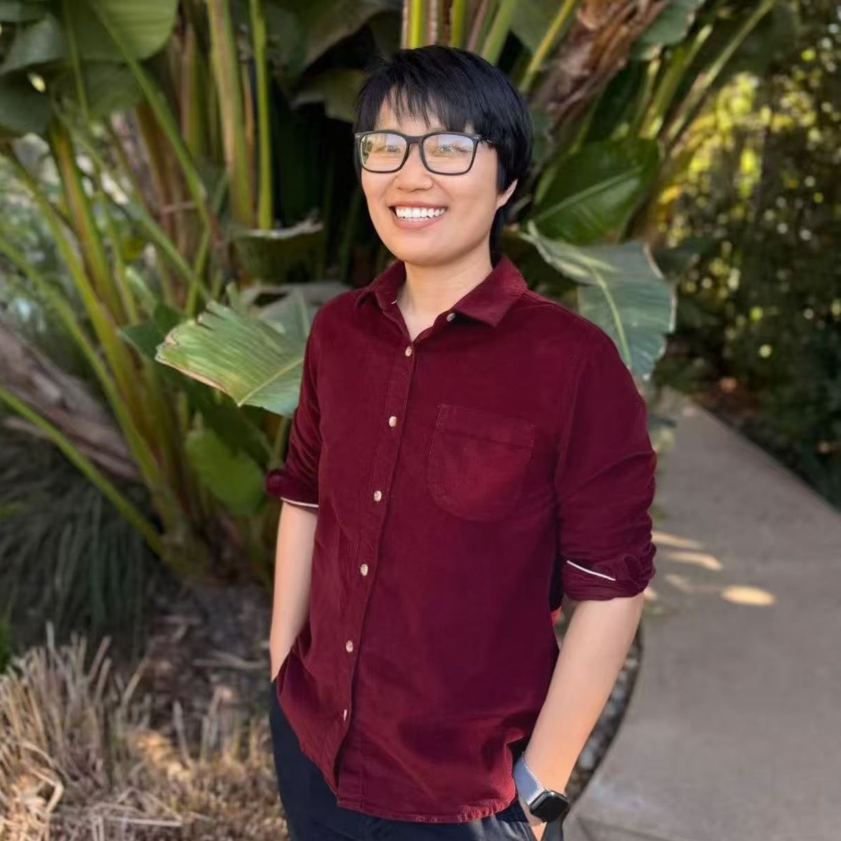 a person standing outside smiling