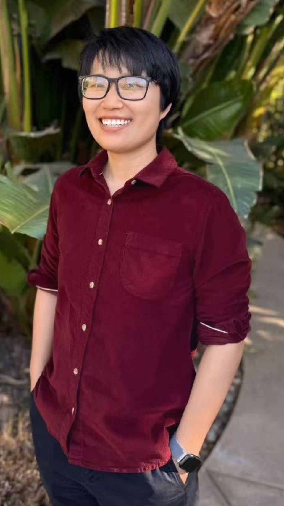 a person smiling with sunglasses