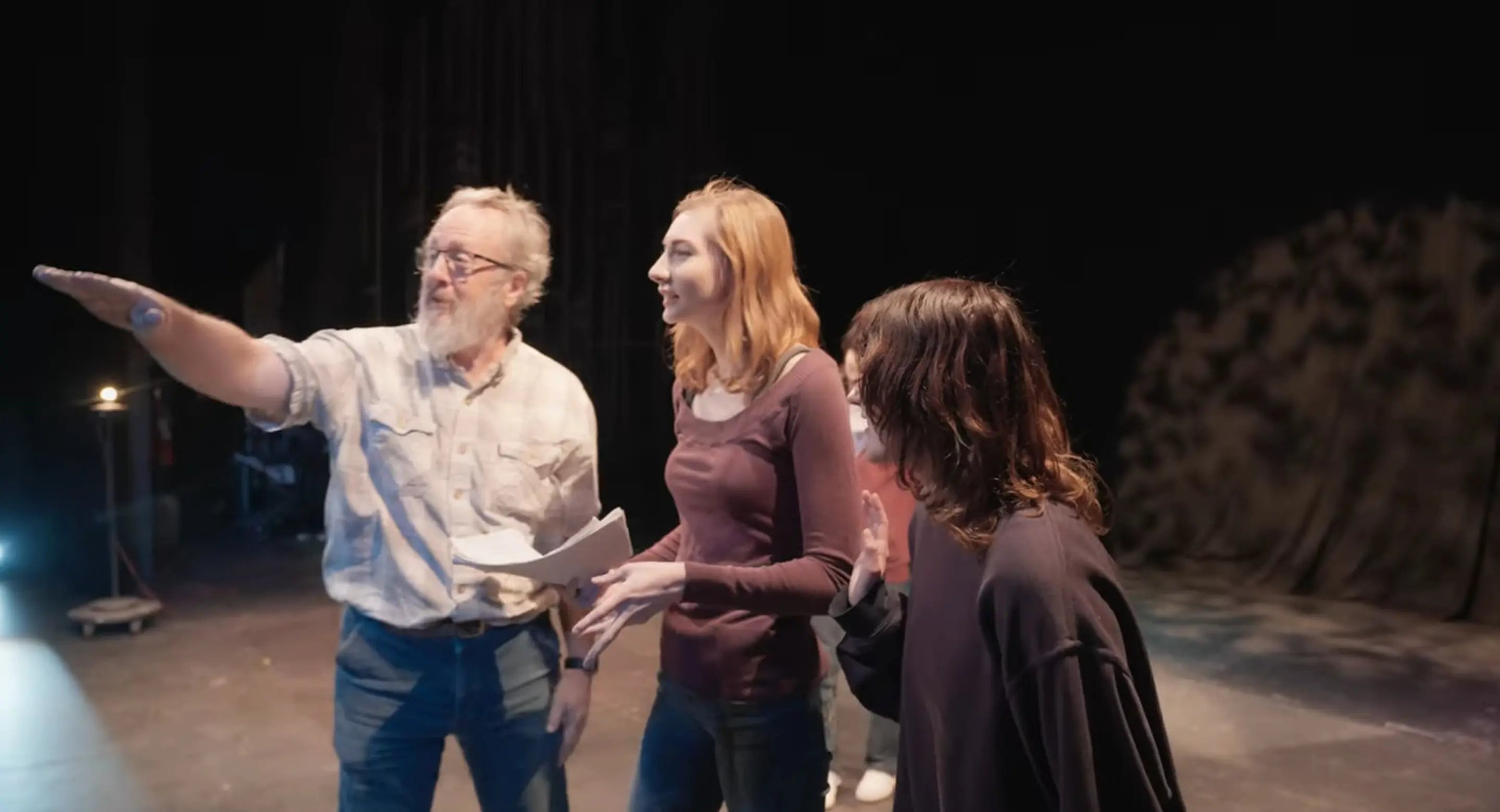 a group of people standing on a stage