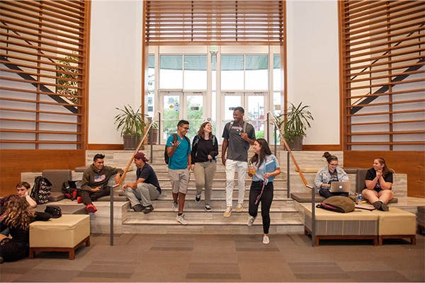 students-walking-through-library