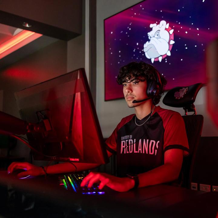 Media card - esports student on computer playing game