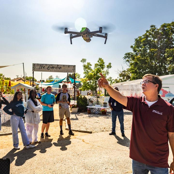 Mutiple media - GIS professor teaching students about drones