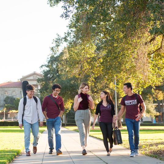 Media card - Graduate students walking together