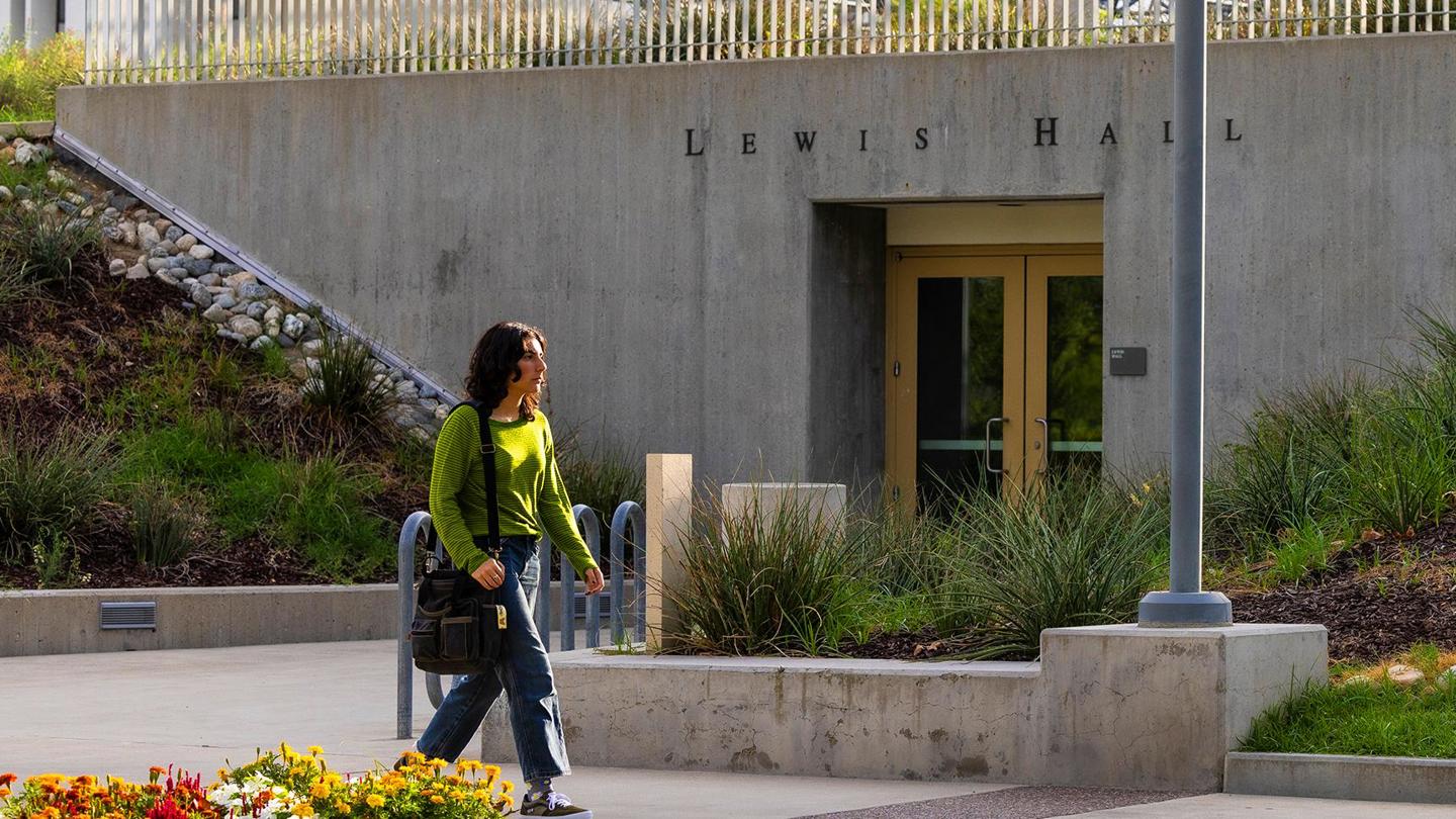 Program media masthead - GIS student walking past Lewis Hall