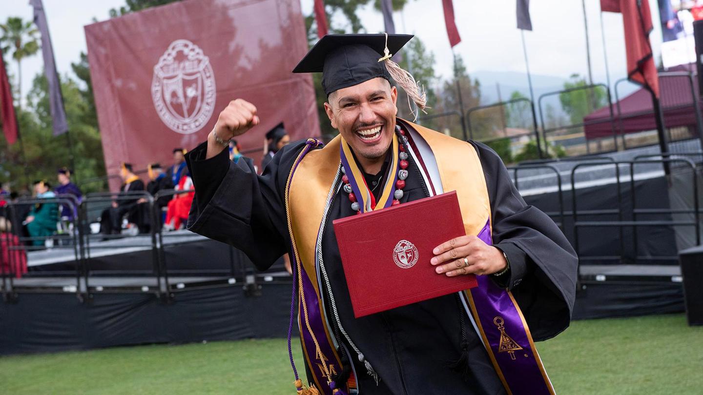 Image card - School of Business graduate student at graduation