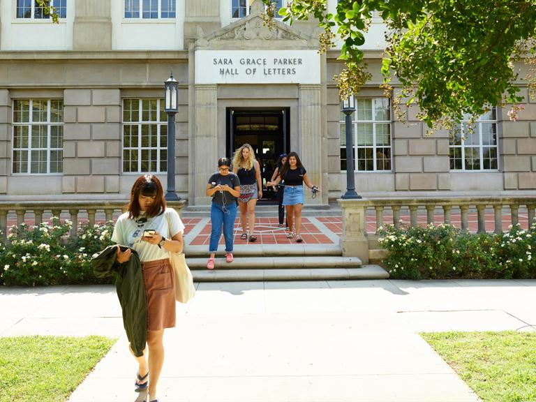 Media masthead - College of liberal arts and sciences students walking to class