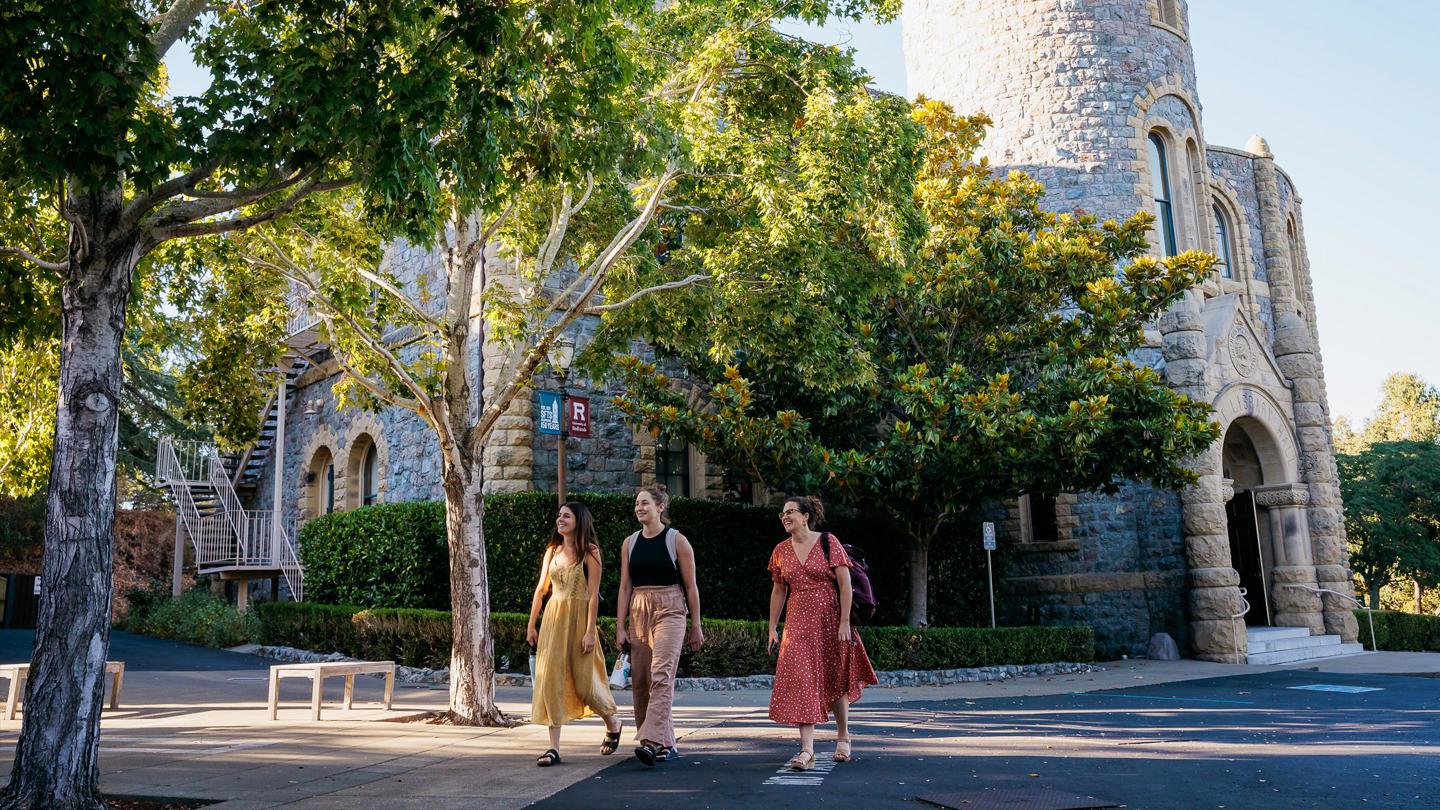 Three students walking on campus at Presidio Graduate School.